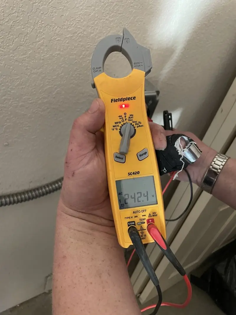 Voltage testing with clamp meter during Generator Installation in Winter Park